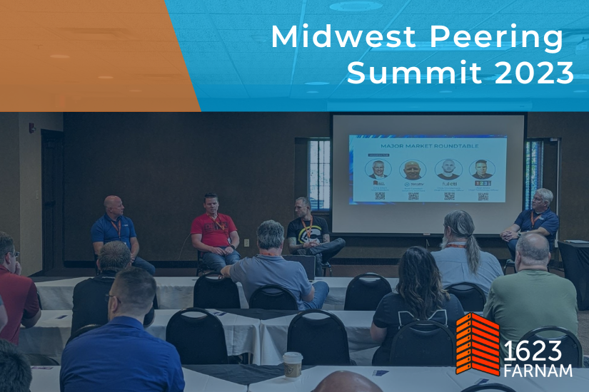 Attendees at the Midwest Peering Summit watch a panel